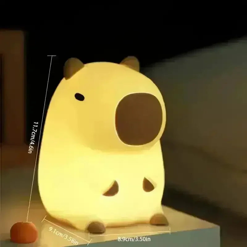 https://cdn.shopify.com/s/files/1/0803/3622/4575/files/buy-3d-silicon-capybara-night-lamp-at-bear-hugs-52009.webp?v=1771000276