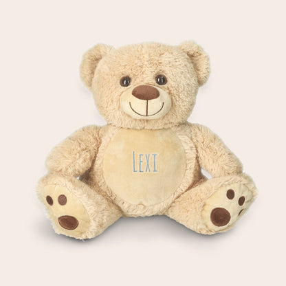 https://static.yoursurprise.com/galleryimage/73/73a2bcf315b0111a5753f55aa8184adb/personalised-baby-s-first-teddy-bear_5.png?width=900&crop=1%3A1&bg-color=F5ECE6&format=jpg